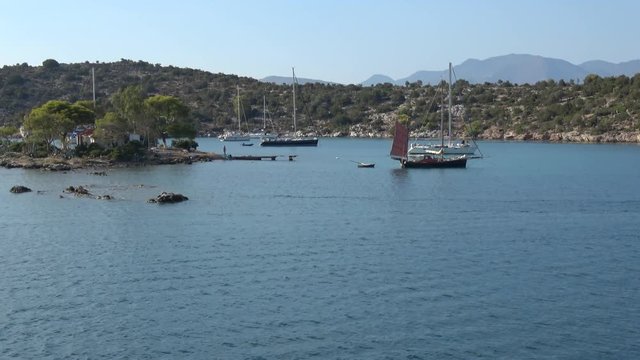 Beautiful Island in Greece and Anchoring Sailing Yachts