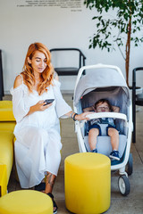 Mom and stroller with her baby