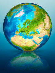 Lithuania on Earth on reflective surface