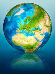 Slovakia on Earth on reflective surface