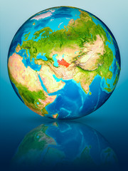 Turkmenistan on Earth on reflective surface