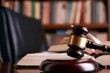 Law gavel or judge mallet on a wooden desk