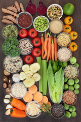 Super food concept for healthy eating with health food of fruit, vegetables, grain, cereals, seeds, herbs and spice high in antioxidants, anthocyanins, fibre, vitamins and minerals. Top view.