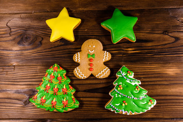 Different christmas gingerbread cookies on wooden table. Top view