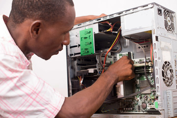 technician repairing computer equipment.