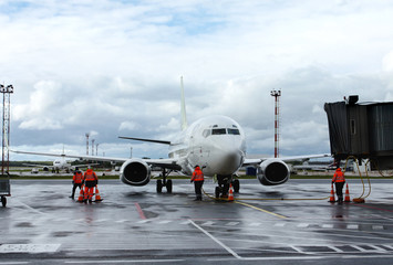 Airplane on refuelling in an airport. Technical service and preparation to flight