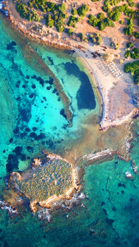 Autumn 2017: Aerial bird's eye view photo taken by drone depicting beautiful deep blue -  turquoise waters and rocky seascape
