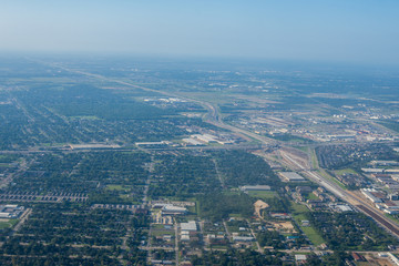 Fototapeta premium Metropolis Area of Houston, Texas Suburbs from Above in an Airplane