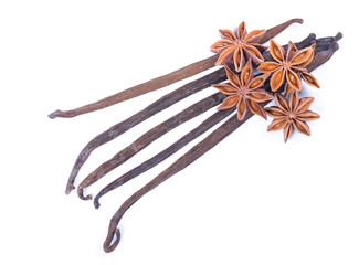 Vanilla bean and star anise on white background