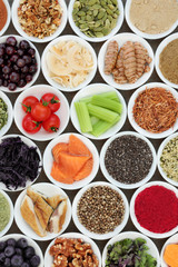 Food to boost brain power including superfood of fish, fruit, vegetables, seeds, nuts, supplement powders with herbs and spices used in herbal medicine. High in omega 3 and antioxidants.