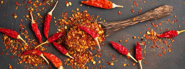 Red hot chili peppers on rusty background