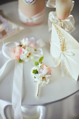 The bride wears a buttonhole for groom.