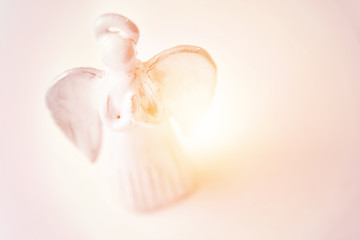 Praying angel toy christmas background.