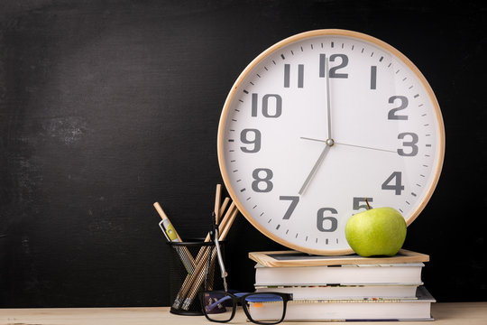 Arrangement Of Clock And School Supplies