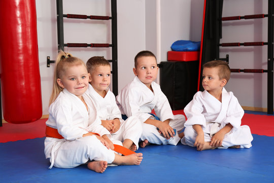 Little children wearing karategi in dojo
