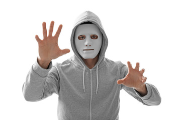 Hacker in mask working with virtual screen on white background