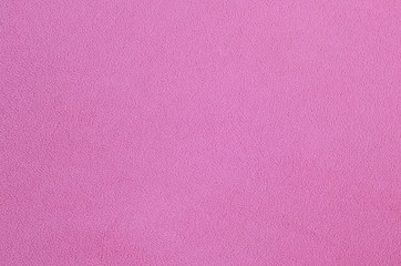 The blanket of furry pink fleece fabric. A background texture of light pink soft plush fleece...