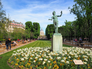 PARIS, FRANCE-MAY 5, 2016: Statue "The Greek Actor" in Luxembourg Gardens in Paris. On the horizon can be seen the building of the Parisian pantheon.