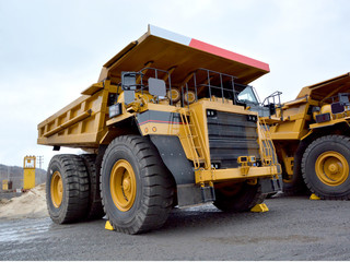 Heavy dump truck for transportation of goods in a quarry.