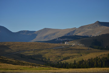 Alpine mountain landscape summer and autumn view in a sunny day with a blue sky