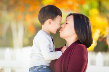 Chinese Mother Having Fun with Her Mixed Race Baby Son