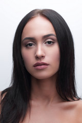 Fototapeta premium Beautiful girl close up face portrait with long hair style.