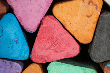 Large multi-colored chalk triangles in multiple colors