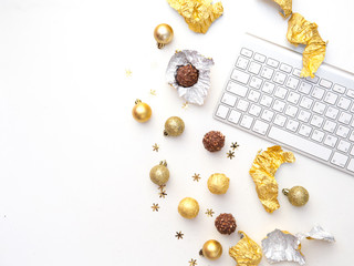 Christmas Office table desk, Flat lay. Workspace with keyboard and Chocolate Candies. Working Holiday. Blogger Concept