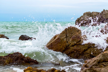 Powerful Waves crushing on a rocky beach