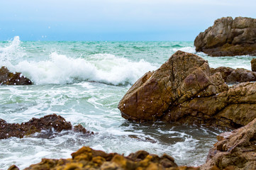 Fototapeta na wymiar Wave and the rock. Beautiful seascape