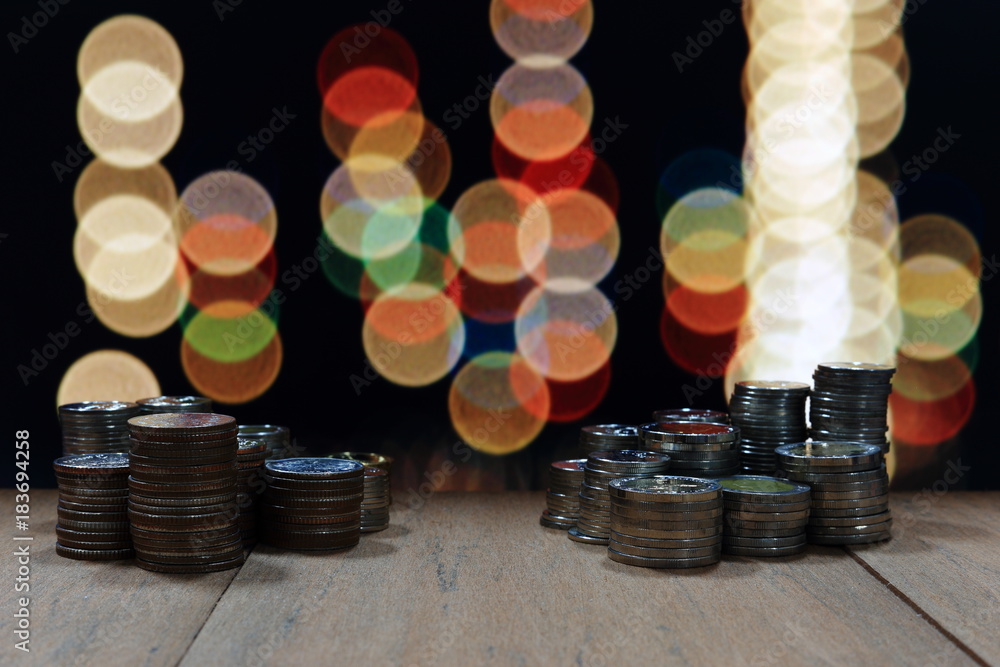 Poster coin pile stack on wood table and background of light bokeh. innovative business saving concept.
