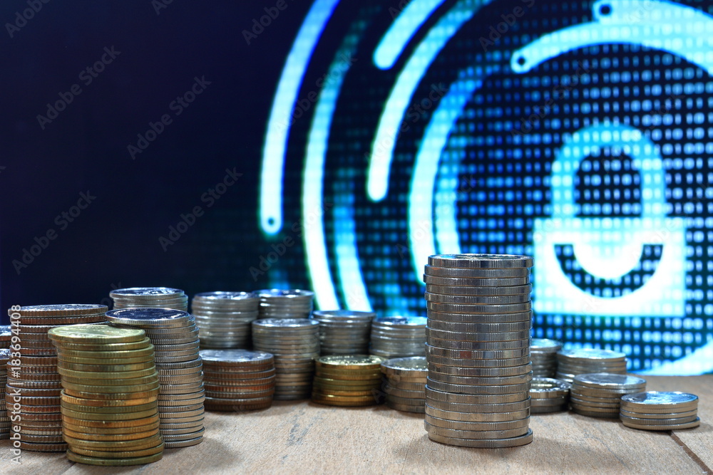 Poster vintage digital economy coin pile stacked in to columns on wooden board. digital binary code in the 