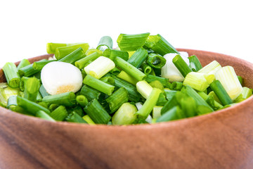 chopped green onions on white background