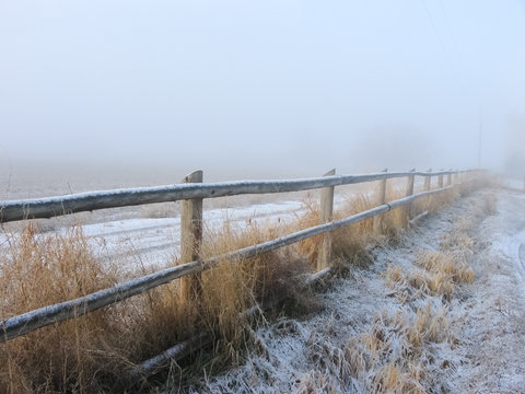 Snowy Fence Line in Countryside