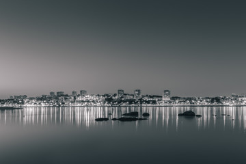 Night shot of Porto observed from across the river Douro (Black and White). Taken from Afurada, Vila Nova de Gaia, Portugal.