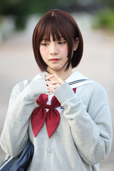 Portrait of Japanese school girl with countryside park