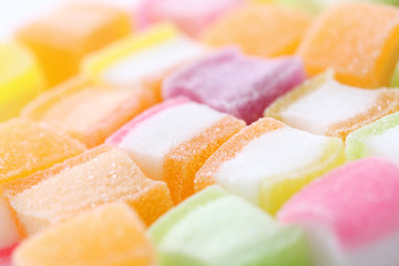 Colorful cube jelly candy isolated in white background