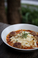 Pasta meatballs tomato sauce on wood background