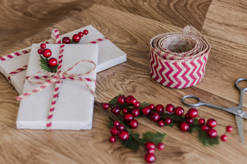 Wrapped Christmas presents on a wood background