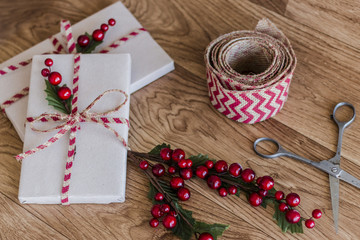 Wrapped Christmas presents on a wood background