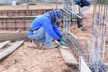 Construction work,the worker making formwork at construction site