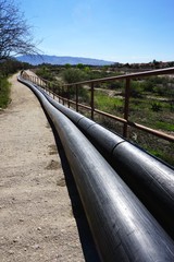 Pipeline above ground receding in the distance