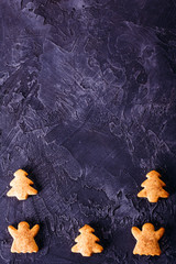 Concrete background with ginger biscuits and copy space