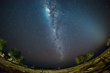Starry sky and Milky Way arch, with details of its colorful core, outstandingly bright, captured...