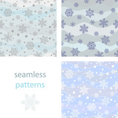 Seamless simple pattern of different blue geometric snowflakes