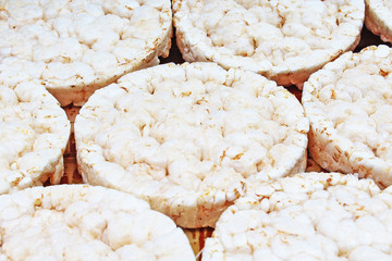 Stack of puffed whole grain crispbread. Rice cake puffed rice texture.Round rice cakes background. Corn crackers. Rice galettes Studio photo texture photography. Food.