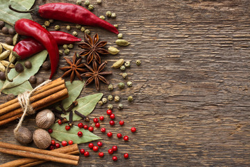  Various spices on a wooden surface closeup
