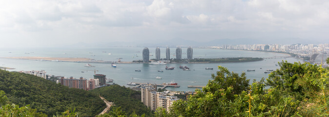Panoramic landscape of the city of Sanya and its nature as well as the island of the phoenix in the center of the frame