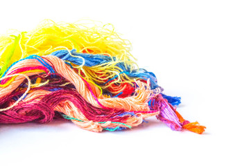 Colorful cotton craft thread on white background with copy space. Colorful yarn for knitting on white background.