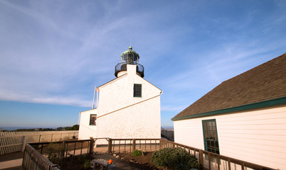 OLD POINT LOMA LIGHTHOUSE AT CABRILLO NATIONAL MONUMENT UNDER BLUE CIRRUS CLOUD SKY AT POINT LOMA SAN DIEGO CALIFORNIA UNITED STATES